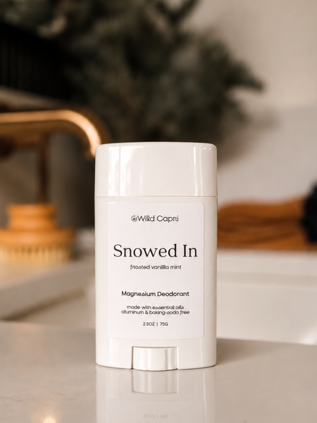 a tube of wild capri snowed in vanilla mint magnesium deodorant on a bathroom counter 